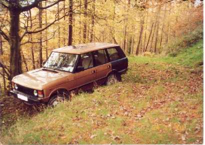 Classic Range Rover in woods north of Llangedwyn