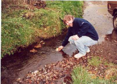 Dick getting water for the Rangerover radiator from a stream