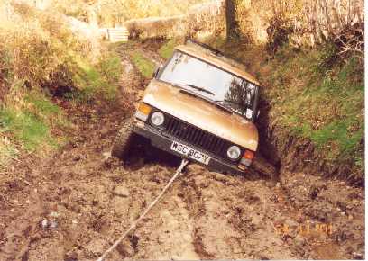 "the Beast" (calssic Rangerover) being hand winched out of ahole using a Hi-lift jack