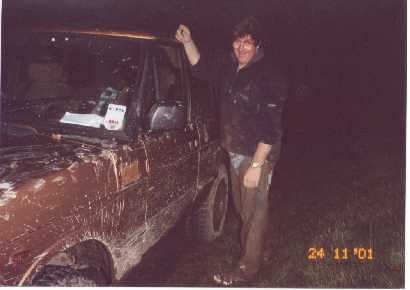 Dick covered in mud after rescuing "the beast" (classic Rangerover) from deep muddy hole