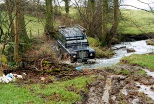 "Dorothy" the SWB seriesIII diesel Landrover crossing a stream in Wales