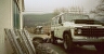 Changing Uriah the Land Rover 110  to the off road tyres in he car park at Llanerchindda farm