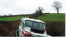 "Uriah" waiting at the lane exit for Dorothy" the SWB seriesIII diesel Landrover which is stuck in a tree