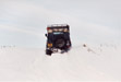 Landrover 110 CSW at the end of a successful ascent of snow covered incline