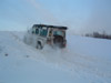 Norman in his Landrover 110 showing how to fail a snow covered ascent
