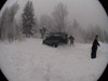 Digging out the Landrover 110 which is snow bound in a forest in south east Poland