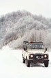 Genae keeping warm inside Norman's Landrover 110 
