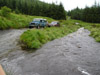 Dick's Landrover 110 CSW and Phil's Discovery waiting to ford the river at Strata Florida