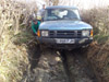 trying to extricate the Discovery buried upto the axles in mud